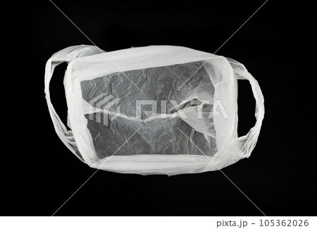 White Plastic Bags on Black Background, Crumpled Plastic Bag after Shopping, Cellophane Packaging Waste 105362026