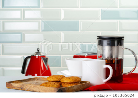 Tea served on a wooden kitchen table 105365024