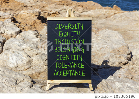 Diversity equity inclusion belonging symbol. Diversity equity inclusion belonging identity tolerance acceptance words written on blackboard on beautiful stone background. Diversity belonging concept. Diversity equity inclusion belonging symbol. Diversity equity inclusion belonging identity tolerance acceptance words written on blackboard on beautiful stone background. Diversity belonging concept. 105365196