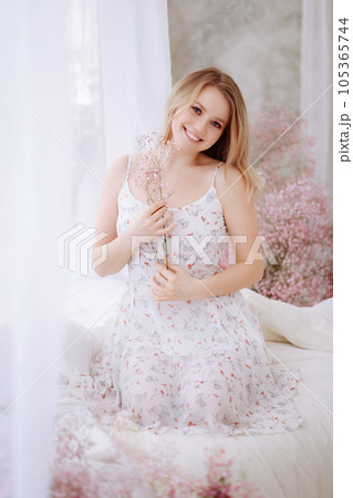 Close-up of a woman's face with flowers 105365744
