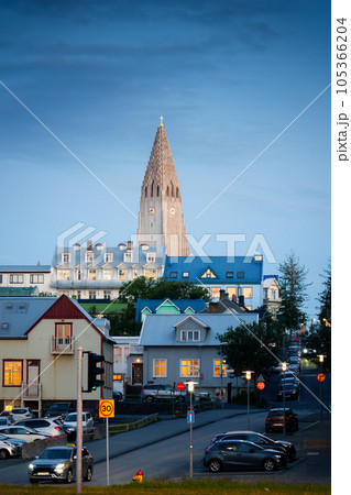 Steeple Hallgrimskirkja Lutheran parish church among the urban village in the dawn at Reykjavik, Iceland Steeple Hallgrimskirkja Lutheran parish church among the urban village in the dawn at Reykjavik, Iceland 105366204