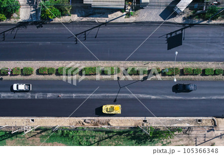New asphalt road and road roller working in improvement project 105366348