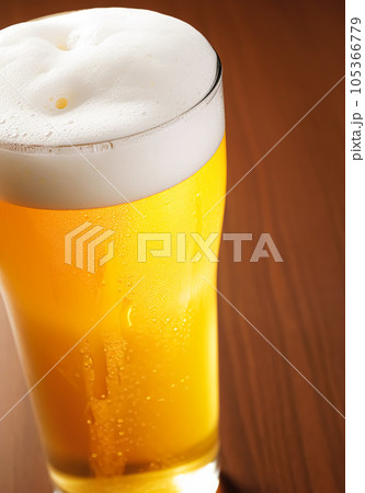 Glass of cold beer with foam, pint of original premium beer drink, alcohol flavour and holiday celebration 105366779