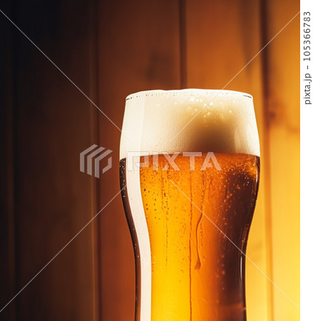 Glass of cold beer with foam, pint of original premium beer drink, alcohol flavour and holiday celebration 105366783