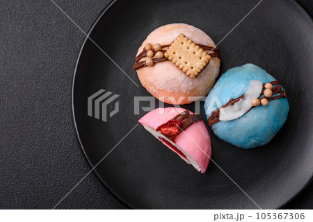 Delicious sweet colorful mochi desserts or ice cream with rice dough and toppings 105367306