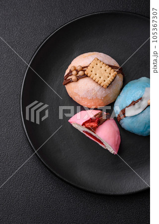 Delicious sweet colorful mochi desserts or ice cream with rice dough and toppings 105367307