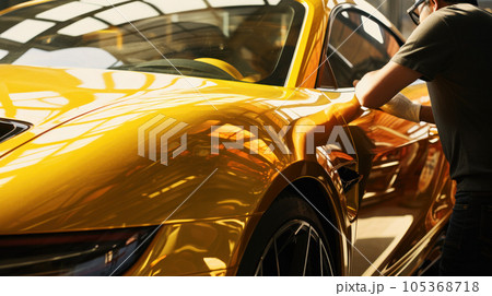 Car wrapping specialist putting vinyl foil or film on car. Car wrapping specialist putting vinyl foil or film on car. 105368718