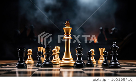 Winner. black king surrounded with gold chess pieces on chess board game competition with copy space on dark background, chess battle, success, team leader, teamwork and business strategy concept 105369410