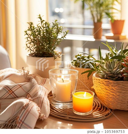 Mindfulness home interior decor, green plants and candles in beautiful afternoon light, natural cozy calm home decoration 105369753