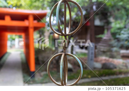 Rings on traditional rain chain, kusaridoi at shrine. Kanazawa, Japan. Rings on traditional rain chain, kusaridoi at shrine. Kanazawa, Japan. 105371625