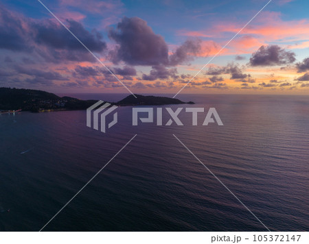 aerial view beautiful purple cloud in pink sky at horizon above the sea..Clouds obscured the pink sky in the evening background for creative nature .and travel concept. sky texture. 105372147