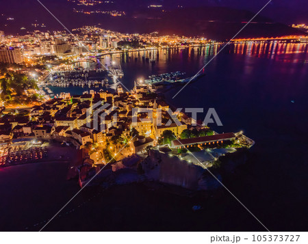 Budva city lights from Montenegro seen from above. Night view. Drone old town Budva at night 105373727