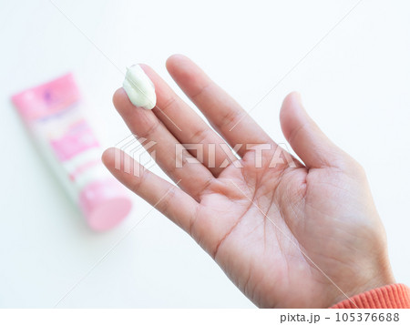 Lotion Body on Finger Woman,Cosmetic Skin Care on Hand for Apply Arm,Moisturizer Soft Spa Beauty Female,Cream Treatment Tester on Palm Up,Girl Applying Hand Cream after Shower in Home. 105376688