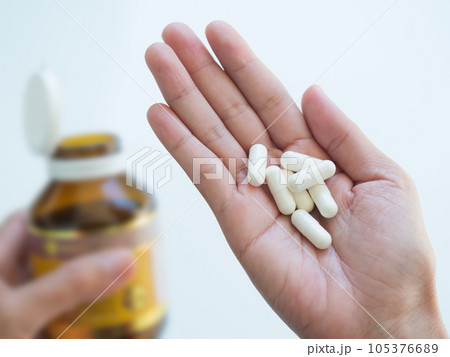 Royal jelly White capsules,Jelly Royal Propolis Nature on Palm Up Young Women with blur Glass Bottle,Honey Energy Supplement Food Medicine for Health,Oil Bee Orgarnic Natural Pharmacy for Diet Healthy 105376689