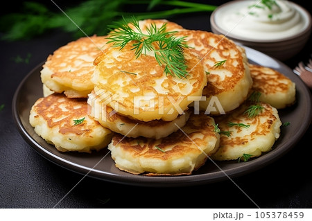 Potato pancakes draniki with dill 105378459