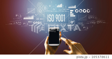 ISO 9001 theme with hand pressing a button 105378611