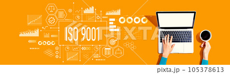 ISO 9001 theme with person using a laptop 105378613