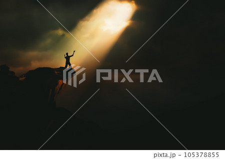 Christian praying to God and man shouting with arms raised to God, pain and trial and sorrow darkness and bright light and rays, hope and despair concept Christian praying to God and man shouting with arms raised to God, pain and trial and sorrow darkness and bright light and rays, hope and despair concept 105378855