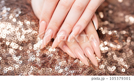Elegant pastel pink natural manicure. Elegant pastel pink natural manicure. 105379301