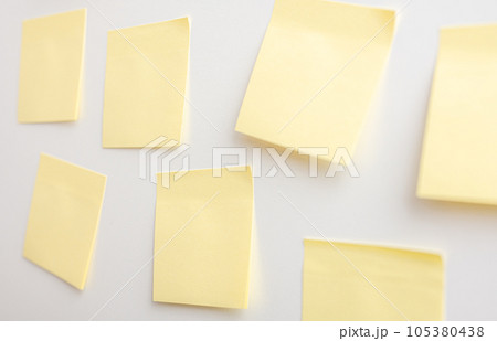 Blank Sticker notes on white background. Mockup sticky Note Paper. Yellow sticky notes with things to do on office board. Discussing business, teamwork, brainstorming concept 105380438