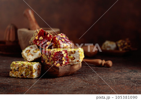 Traditional Turkish delight on an old brown table. Traditional Turkish delight on an old brown table. 105381090