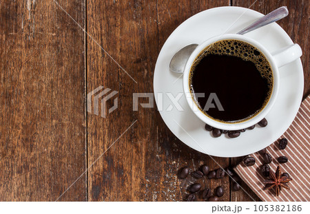 Coffee cup on wooden table background 105382186