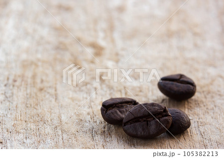 coffee beans on grunge wooden background 105382213