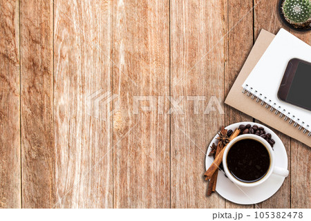 Office desk with coffee cup and smart phone 105382478