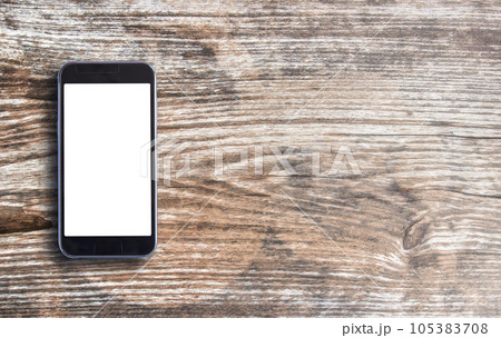 Smart phone on old wooden background Smart phone on old wooden background 105383708