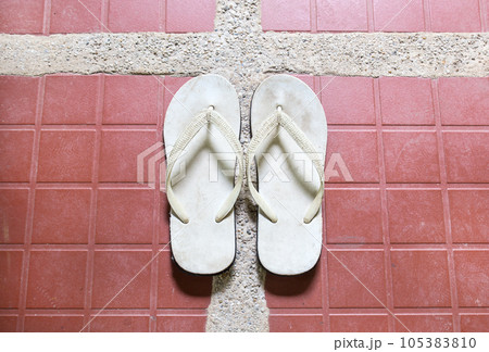 Close up white sandal on floor Close up white sandal on floor 105383810