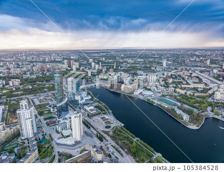 Yekaterinburg city and pond aerial panoramic view at summer sunset. Yekaterinburg city and pond aerial panoramic view at summer sunset. 105384528
