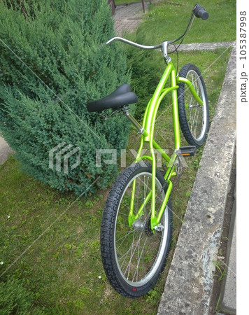 Stylish green bicycle Stylish green bicycle 105387998
