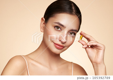 Beautiful Girl With Pill With Cod Liver Oil Omega-3 Beautiful Girl With Pill With Cod Liver Oil Omega-3 105392789