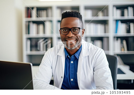 Smiling African-American male doctor in his office looking at camera. 105393495