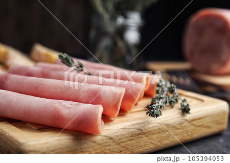 Slices of tasty ham on table, closeup Slices of tasty ham on table, closeup 105394053