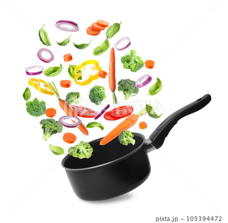 Many different ingredients falling into saucepan on white background. Delicious recipe 105394472