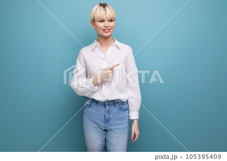 young blond office worker woman in white shirt reporting news at work young blond office worker woman in white shirt reporting news at work 105395409