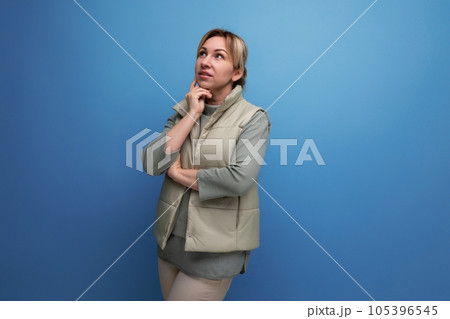 portrait of meditating caucasian blond young woman in spring look on studio background portrait of meditating caucasian blond young woman in spring look on studio background 105396545