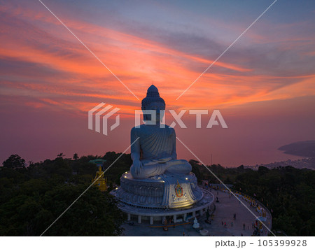 aerial view Phuket big Buddha in beautiful sunset. the sun shines through the clouds impact on ocean surface The beauty of the statue fits perfectly with the charming nature. cloud scape background. aerial view Phuket big Buddha in beautiful sunset. the sun shines through the clouds impact on ocean surface The beauty of the statue fits perfectly with the charming nature. cloud scape background. 105399928