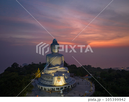 aerial view Phuket big Buddha in beautiful sunset..the sun shines through the clouds impact on ocean surface.The beauty of the statue fits perfectly with the charming nature..cloud scape background.. aerial view Phuket big Buddha in beautiful sunset..the sun shines through the clouds impact on ocean surface.The beauty of the statue fits perfectly with the charming nature..cloud scape background.. 105399942