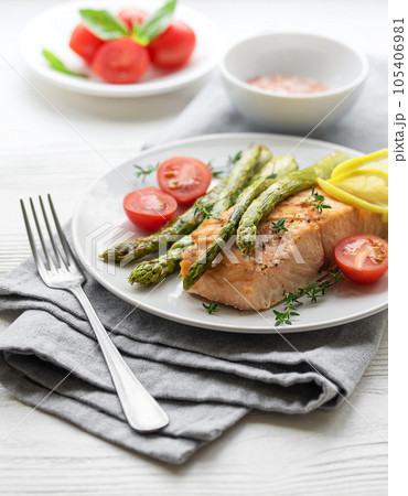 Baked Delicious salmon, green asparagus on plate Baked Delicious salmon, green asparagus on plate 105406981