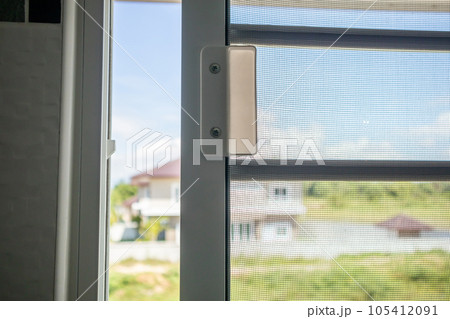 Open mosquito net wire screen on house window protection against insect Open mosquito net wire screen on house window protection against insect 105412091