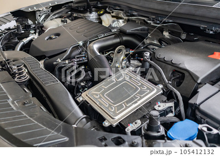 modern car engine under hood close up detail modern car engine under hood close up detail 105412132