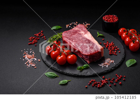 Fresh raw beef striploin steak with salt, spices and herbs Fresh raw beef striploin steak with salt, spices and herbs 105412185