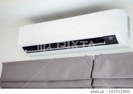 Air conditioner on white wall room interior background Air conditioner on white wall room interior background 105412900