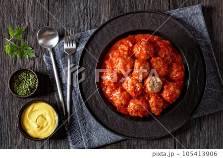 Iowa Ham Balls with tomato sauce in bowl 105413906