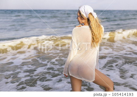 Sexy Woman With Topless Slim Body On Sea Beach At Sunset 105414193