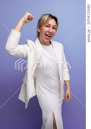 young modern well-groomed blond boss woman in a white jacket and dress young modern well-groomed blond boss woman in a white jacket and dress 105415080