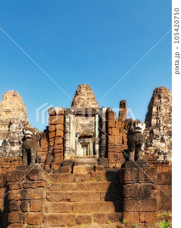 Blue cloudless sky over ancient Khmer ruins, stone steps, East Mebon. Blue cloudless sky over ancient Khmer ruins, stone steps, East Mebon. 105420750