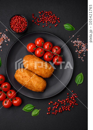 Delicious baked potato cutlet stuffed with chicken and vegetables, spices and salt 105421765